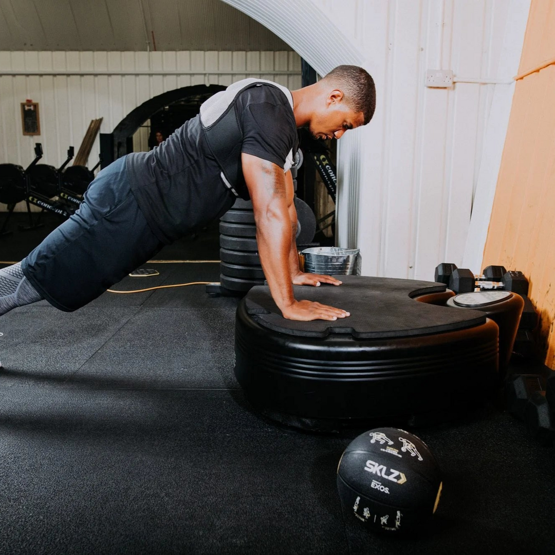 Person using a Power Plate pro5HP in gym