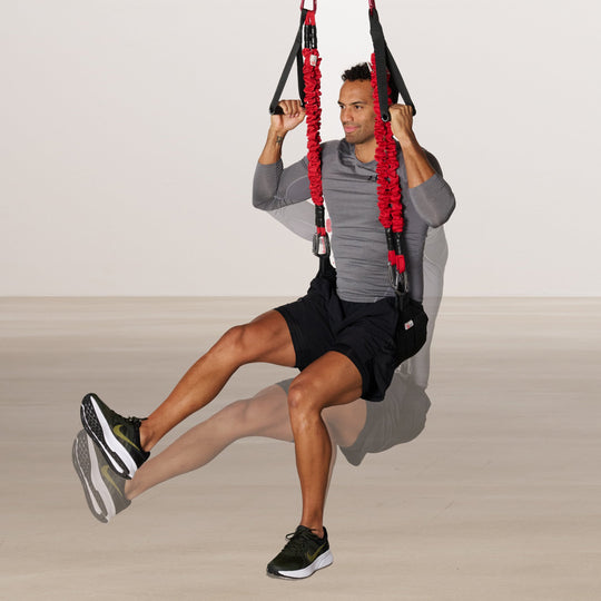 Person using a 4D PRO® Bungee Trainer System in a home setting