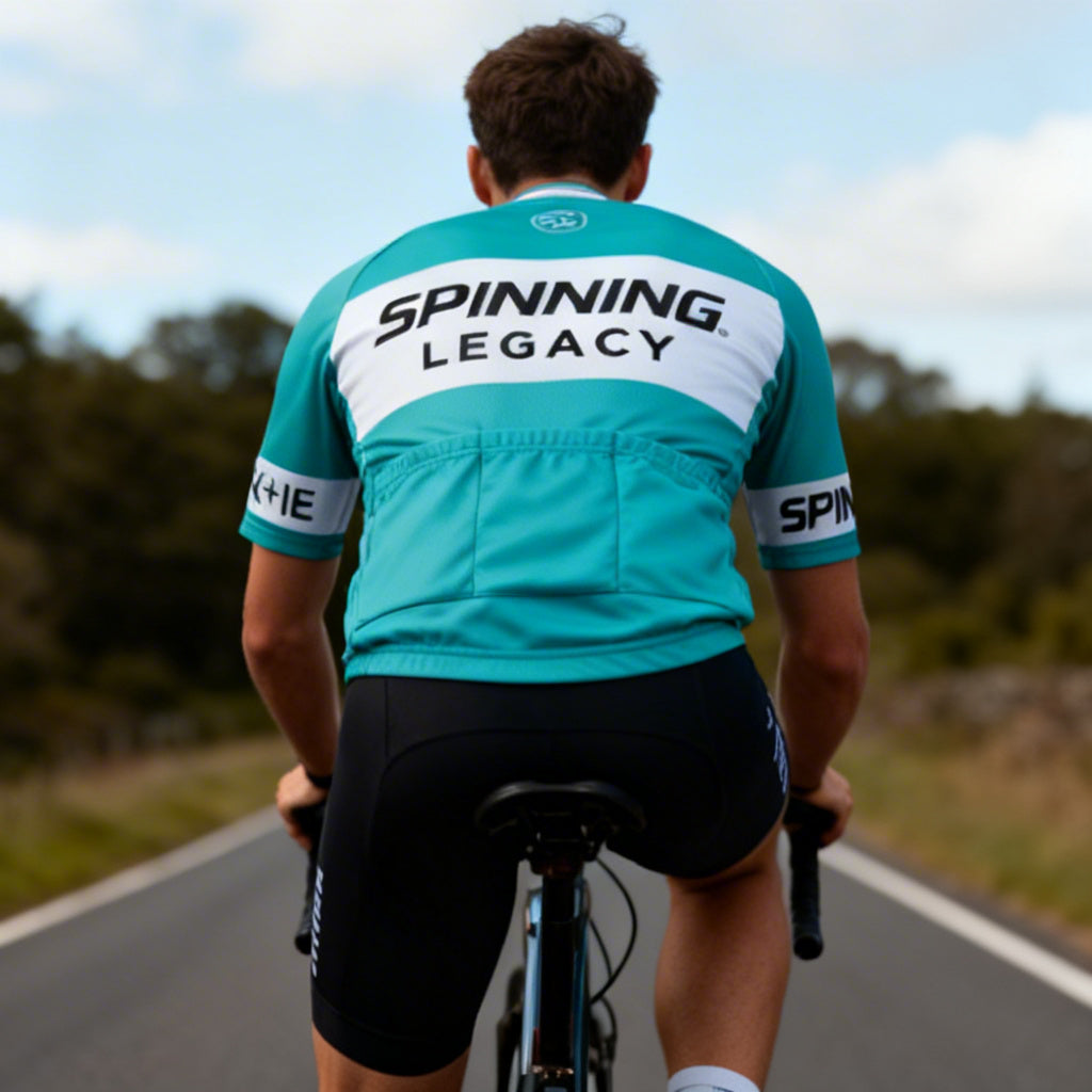 Legacy Cycle Jersey for PROS Spinning® indoor cycling Conference - Cyclist riding outdoors Back view